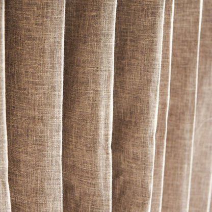 Close-up of brown textured fabric with vertical pleats