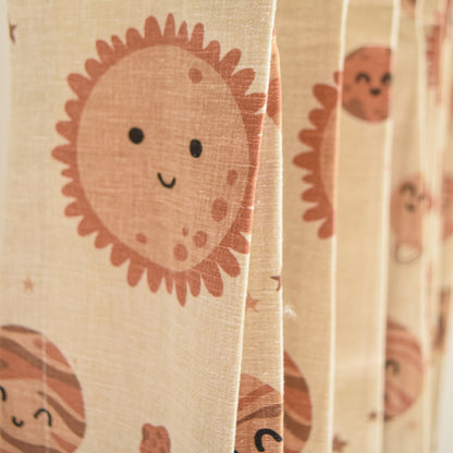 Sheer curtain with cartoon sun design on beige background
