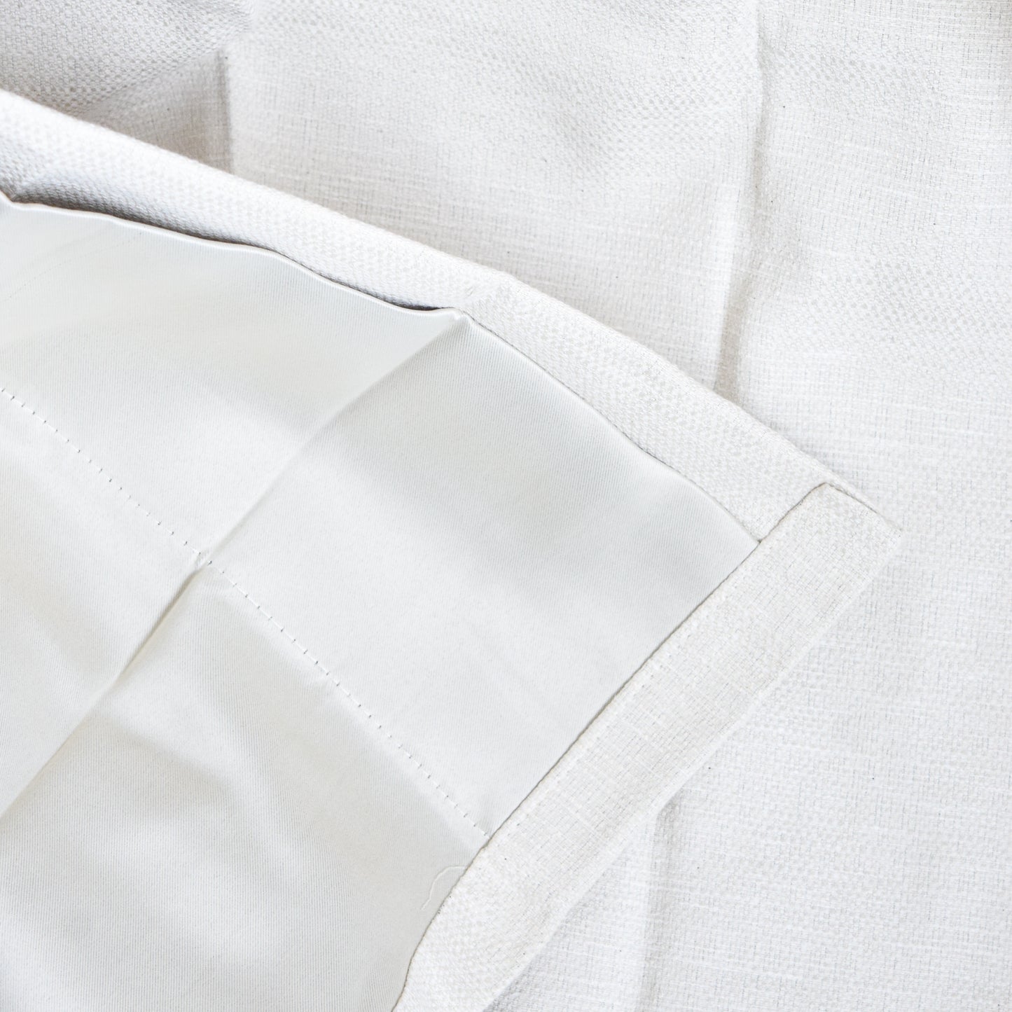 Close-up of white fabric with a textured pattern