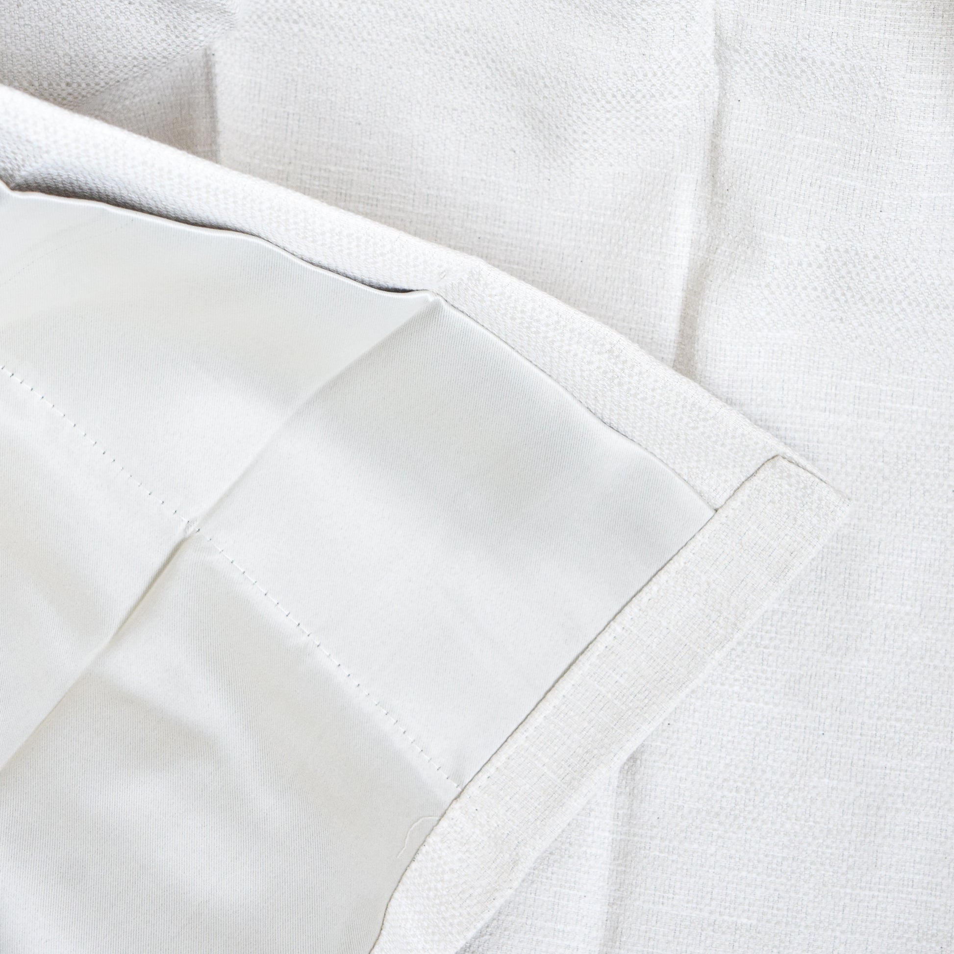 Close-up of white fabric with a textured pattern