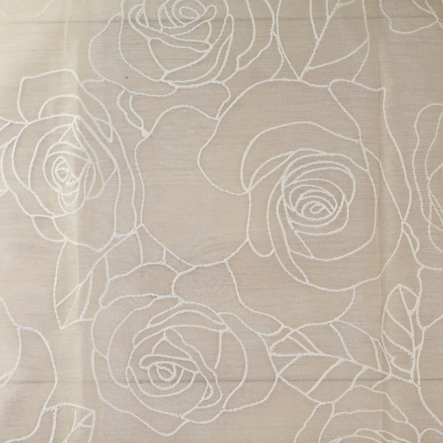 Beige fabric with white floral embroidery pattern