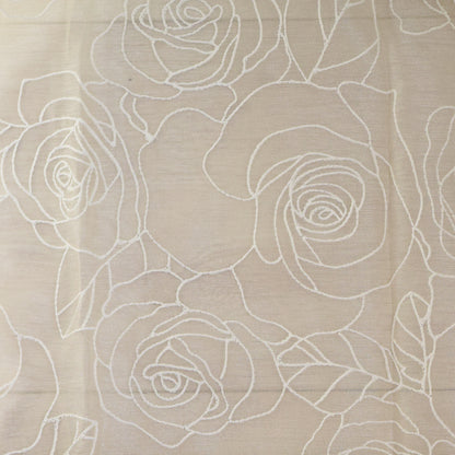Beige fabric with white floral embroidery pattern