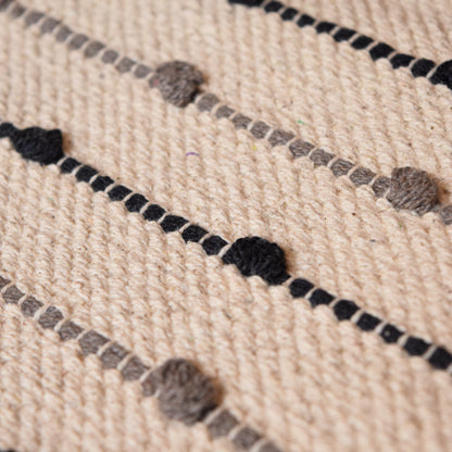 Close-up of a textured fabric with black and gray patterns
