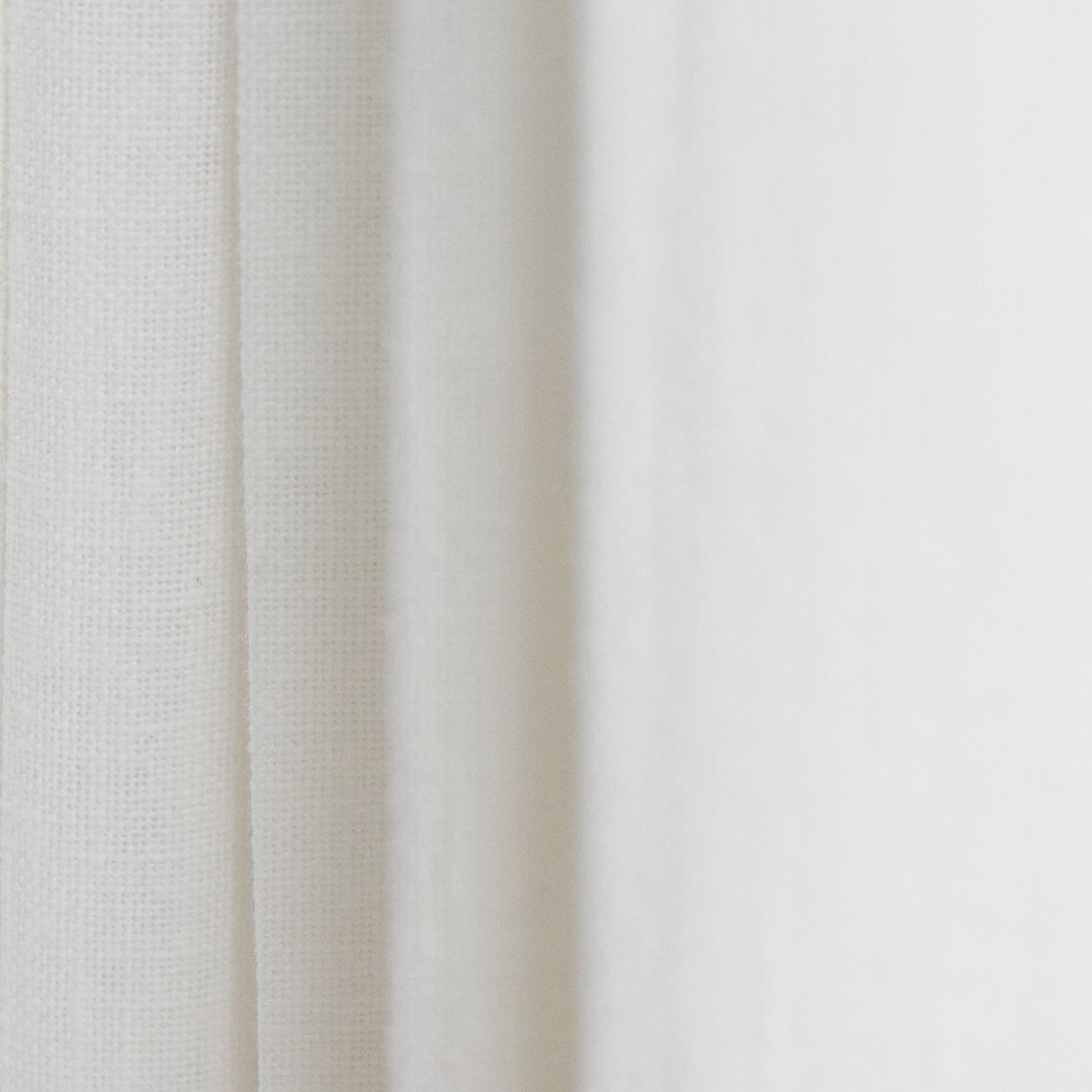 Close-up of white fabric with subtle texture